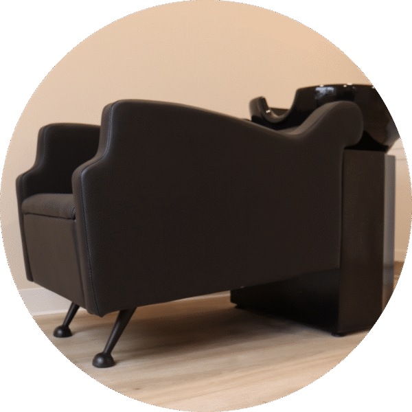A stylish black backwash unit for hair washing.